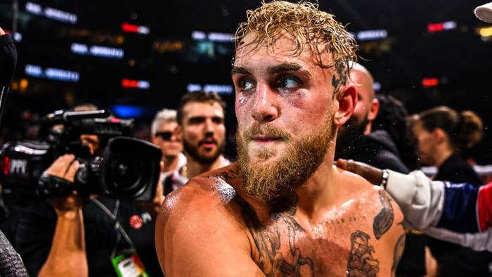 Jake Paul celebrates after knocking out former UFC welterweight champion Tyron Woodley