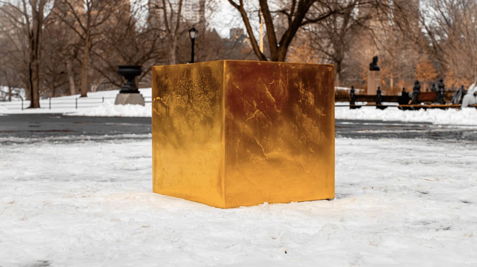 gold cube art in central park