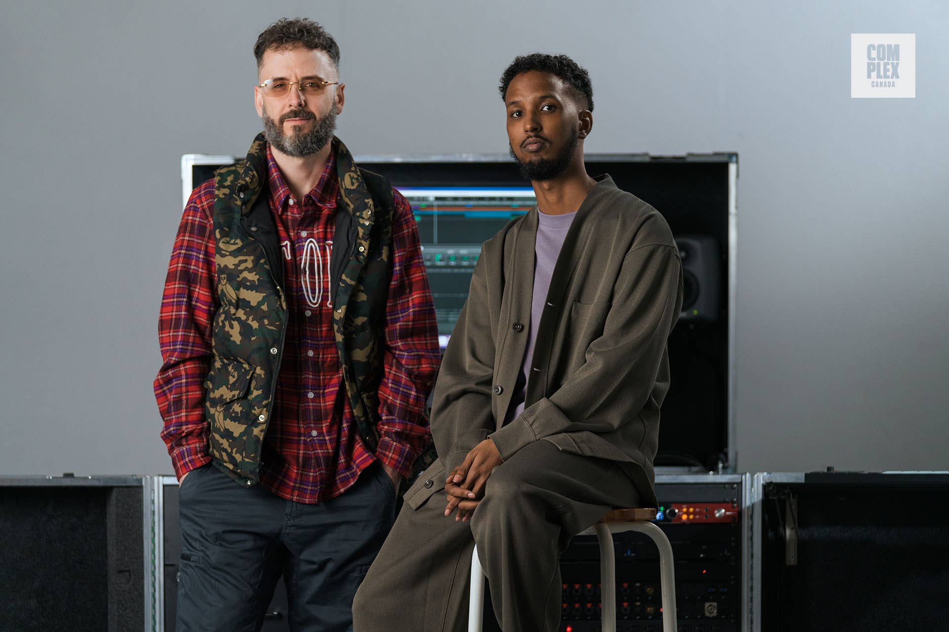 Noah "40" Shebib and Yonis Hassan, of the Justice Fund, pose in front of a mobile studio