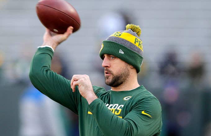 Aaron Rodgers warms up before the Wildcard Game against the Giants.