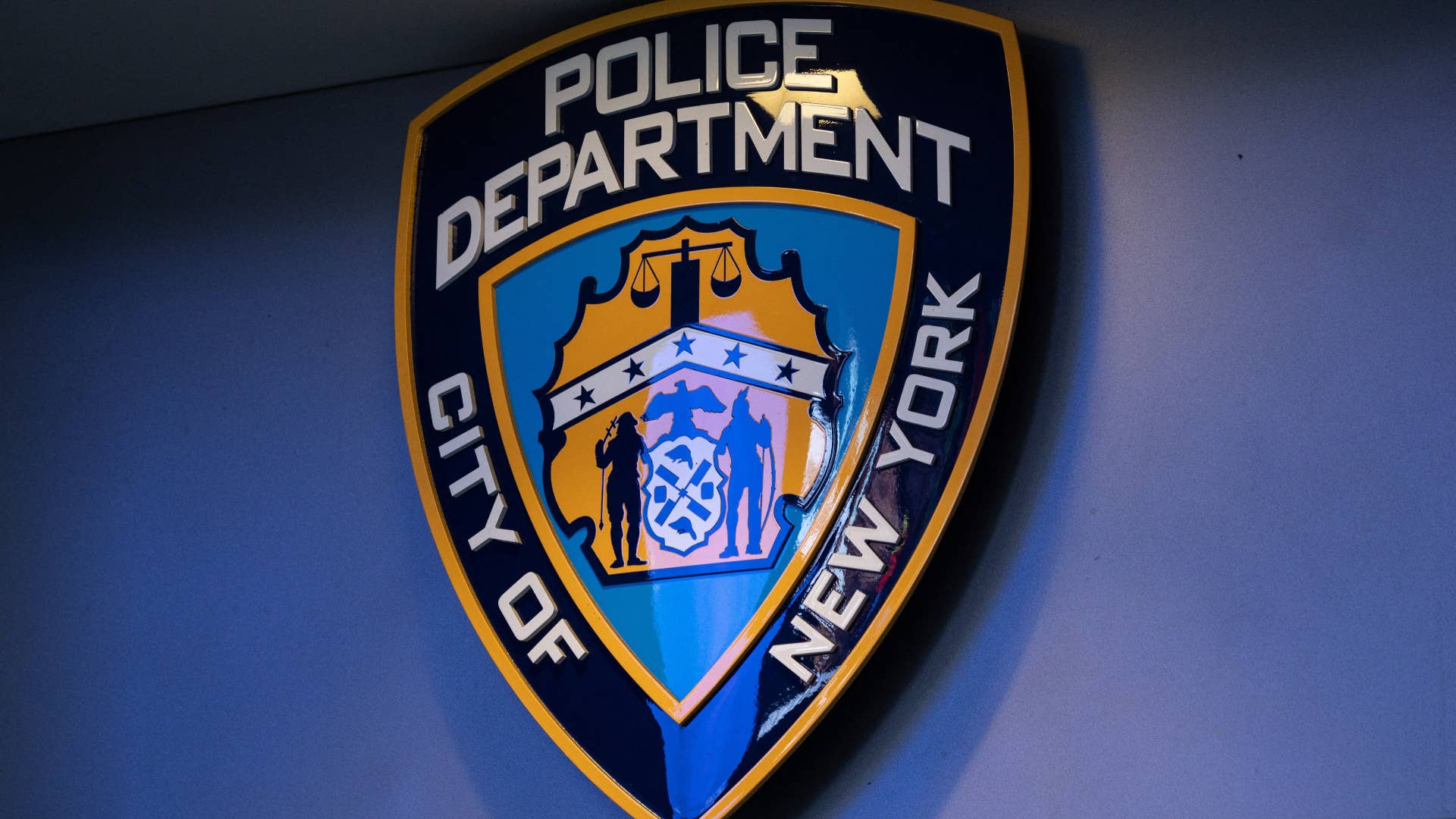 NYPD logo is pictured hanging on wall