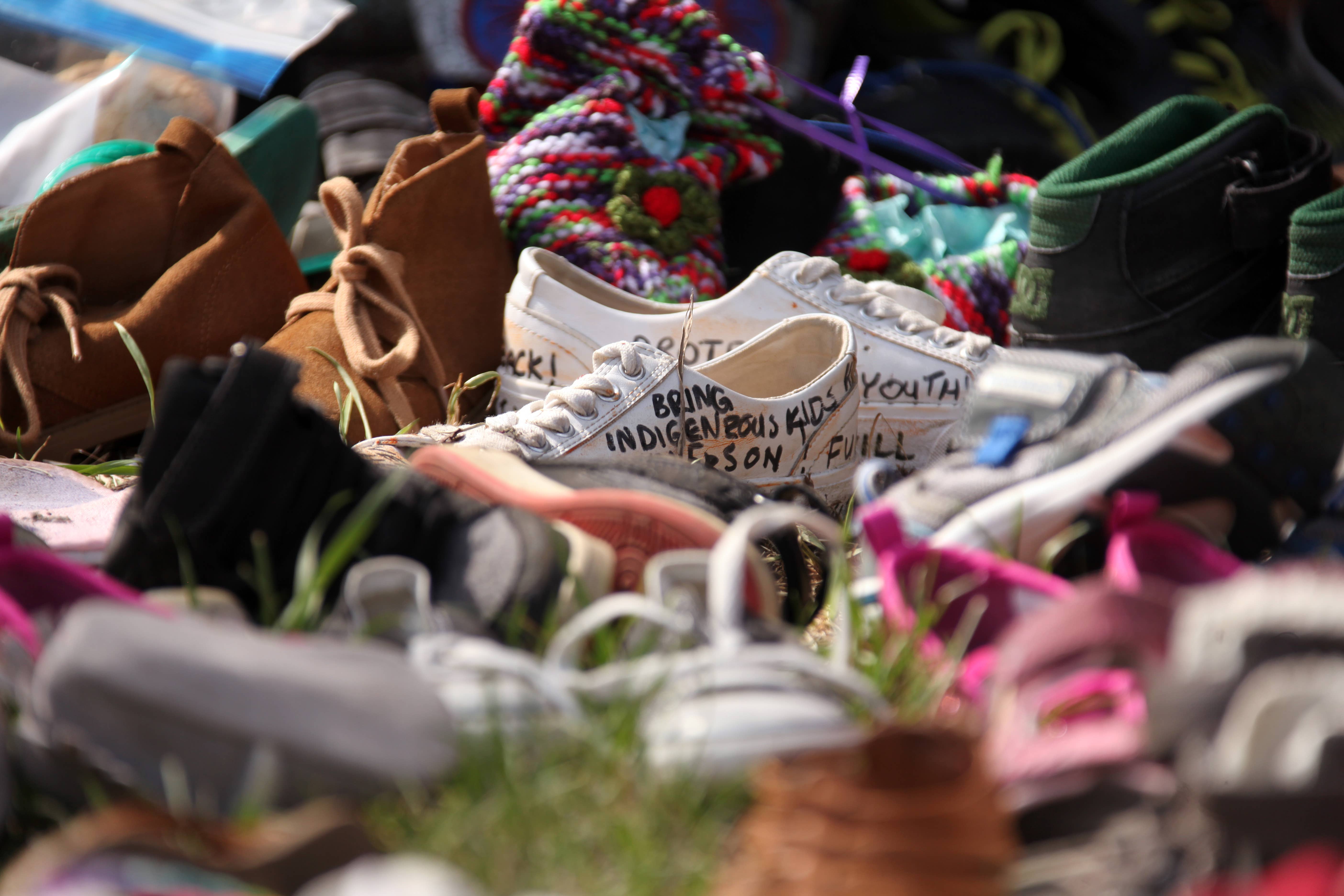 Shoes are placed at Ryerson Univerisity to mourn 215 indigenous children whose remains were discovered at a former residential school on June 7, 2021 in Toronto, Canada.