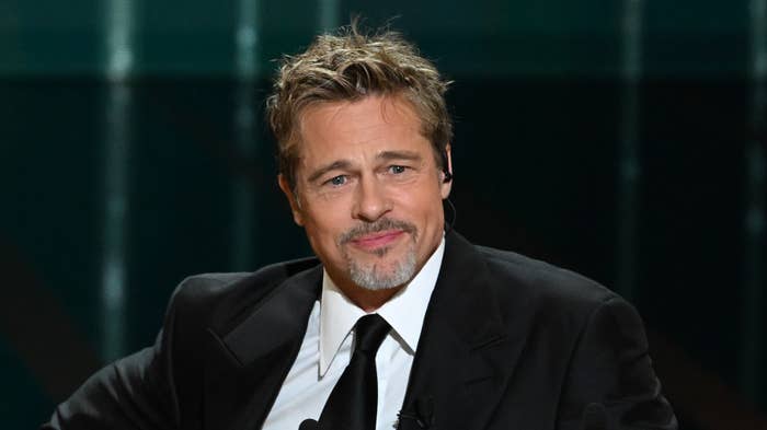 Brad Pitt appears onstage during an international awards ceremony.