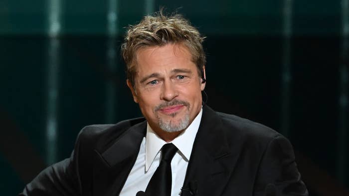 Brad Pitt appears onstage during an international awards ceremony.