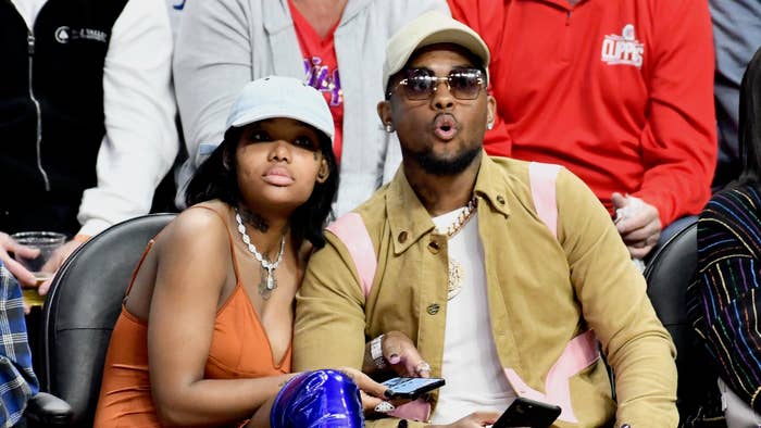 Musician Summer Walker and producer London On Da Track attend a basketball game