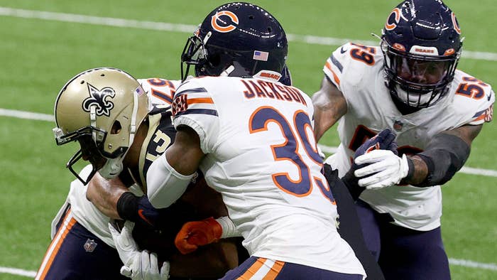 Bears players tackle Michael Thomas of the New Orleans Saints.