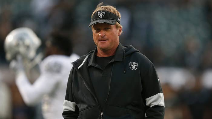 Head coach Jon Gruden of the Oakland Raiders walks on the field.