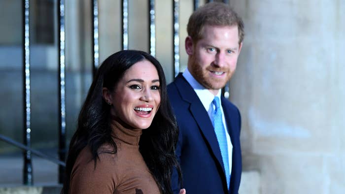Prince Harry and Meghan Markle react after their visit to Canada House.