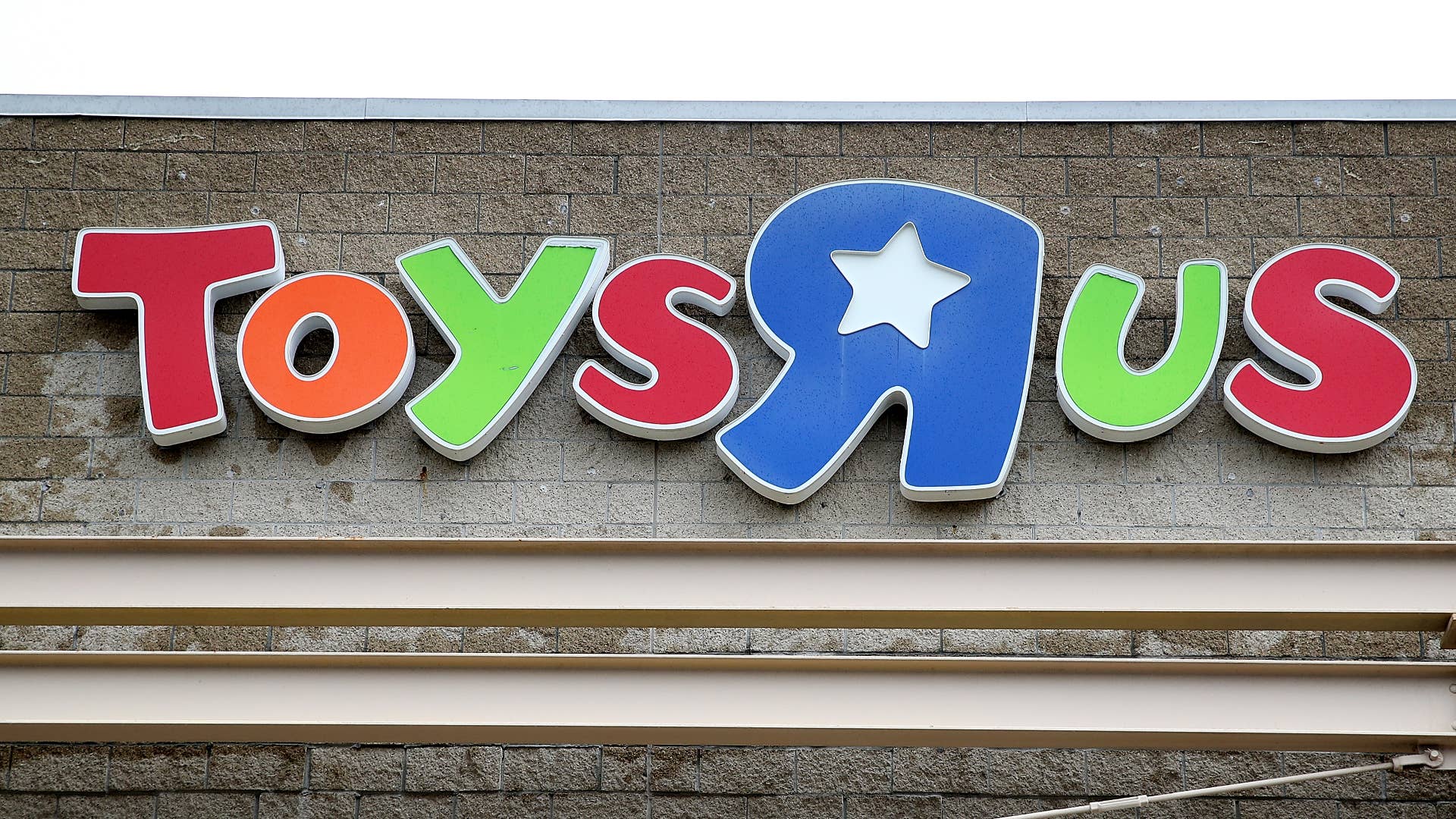 The Toys R Us logo is displayed on the exterior of a store on March 15, 2018 in Emeryville, California.