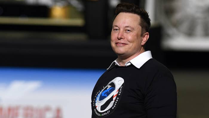 Elon Musk is seen wearing a space shirt