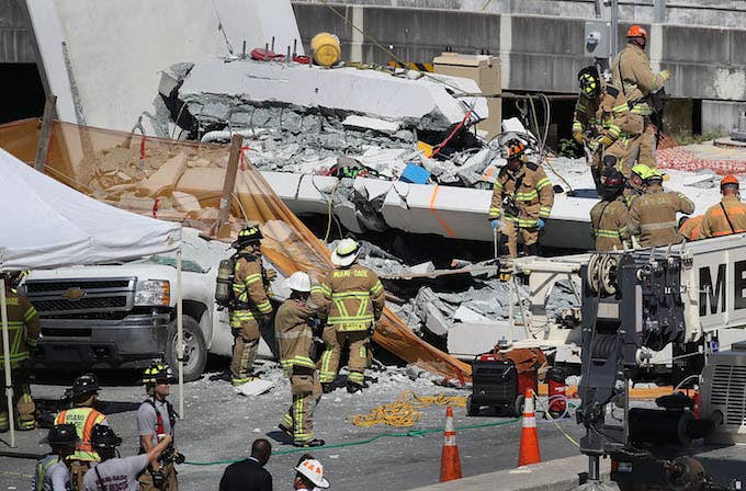 Firefighters at Miami bridge collapse