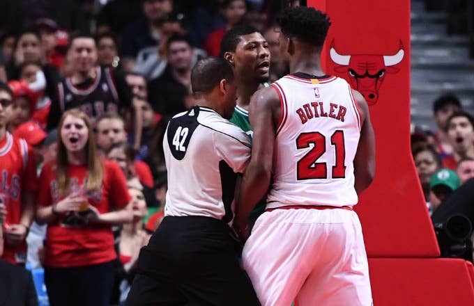 Jimmy Butler and Marcus Smart butt heads on the court.