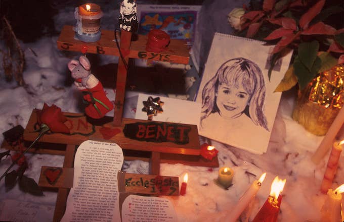 People light candles at the murder site of 6 year old Jonbenet Ramsey.