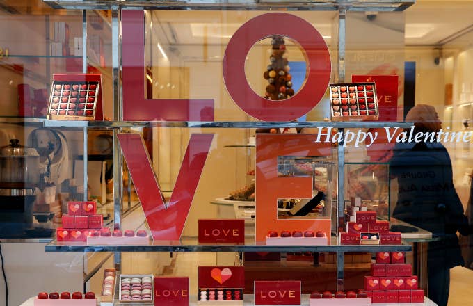 heart shaped chocolates are seen in the window of a pastry shop