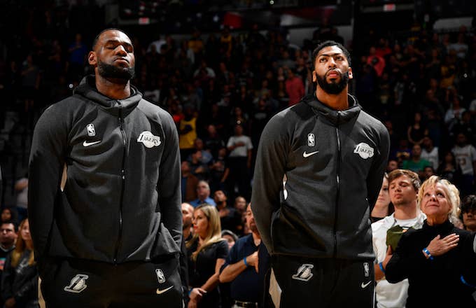 LeBron James and Anthony Davis of the Los Angeles Lakers stand for the National Anthem..