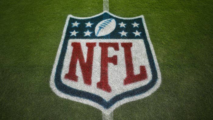 A detail shot of the NFL shield logo painted on the grass