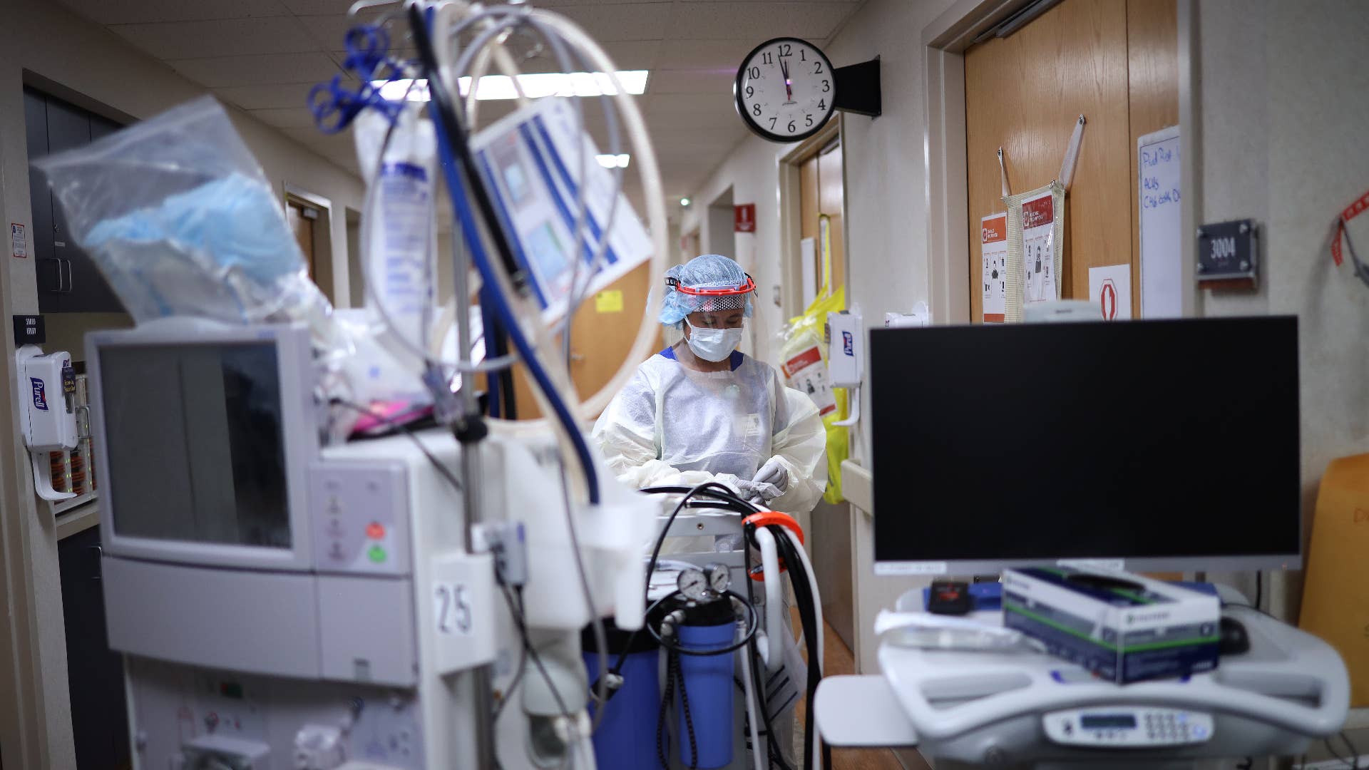 A member of the dialysis prepares to treat a patient with coronavirus in the intensive care unit.