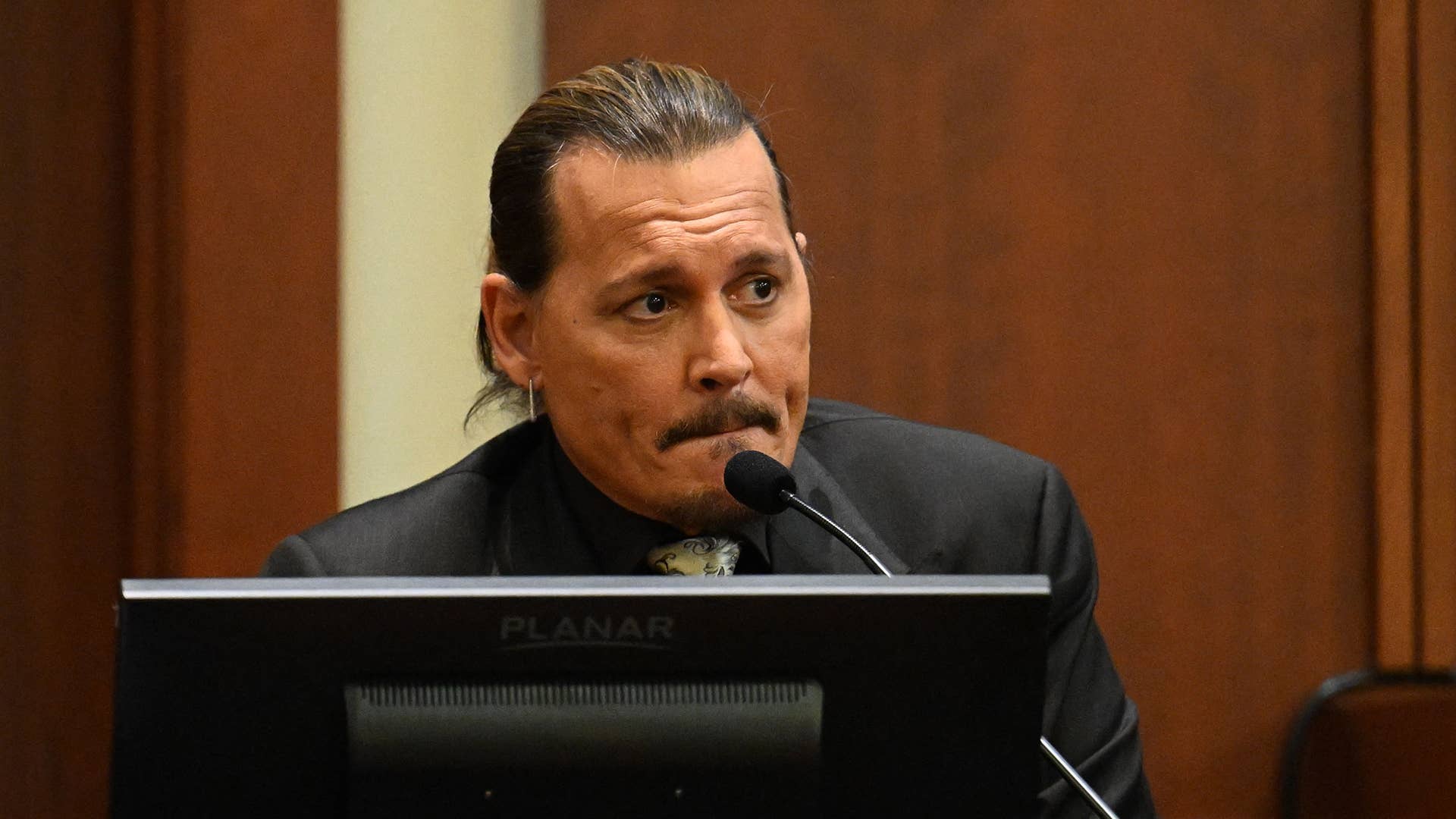 US actor Johnny Depp testifies during his defamation trial in the Fairfax County Circuit Courthouse in Fairfax, Virginia