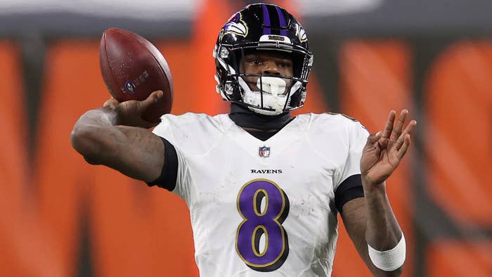 Lamar Jackson #8 of the Baltimore Ravens attempts a pass