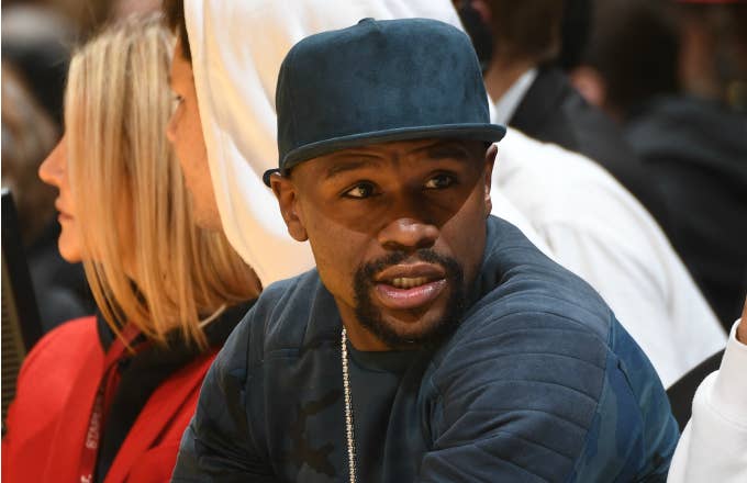 Professional boxer Floyd Mayweather attends a game