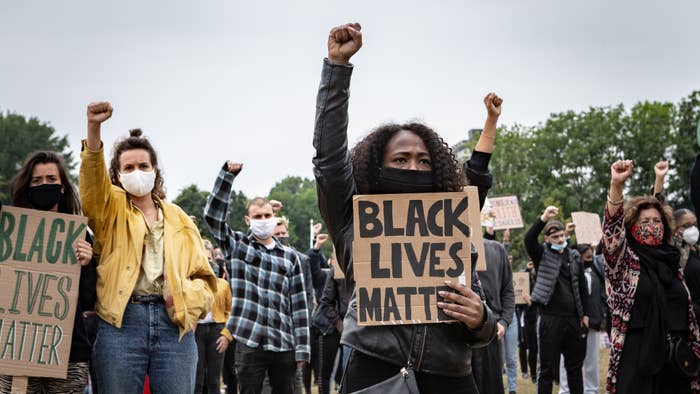 Protesters take part in a demonstration against police brutality and racism.