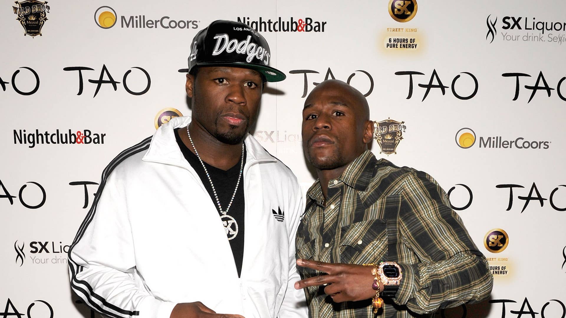 50 Cent (L) and boxer Floyd Mayweather Jr.