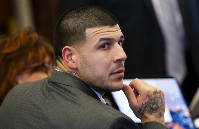 Aaron Hernandez listens during his double murder trial.