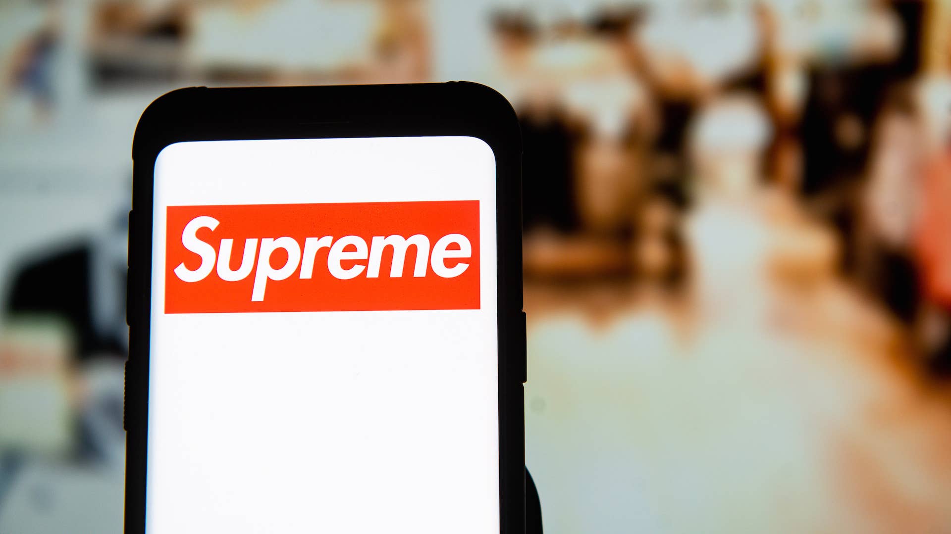 Supreme logo seen displayed on a smartphone