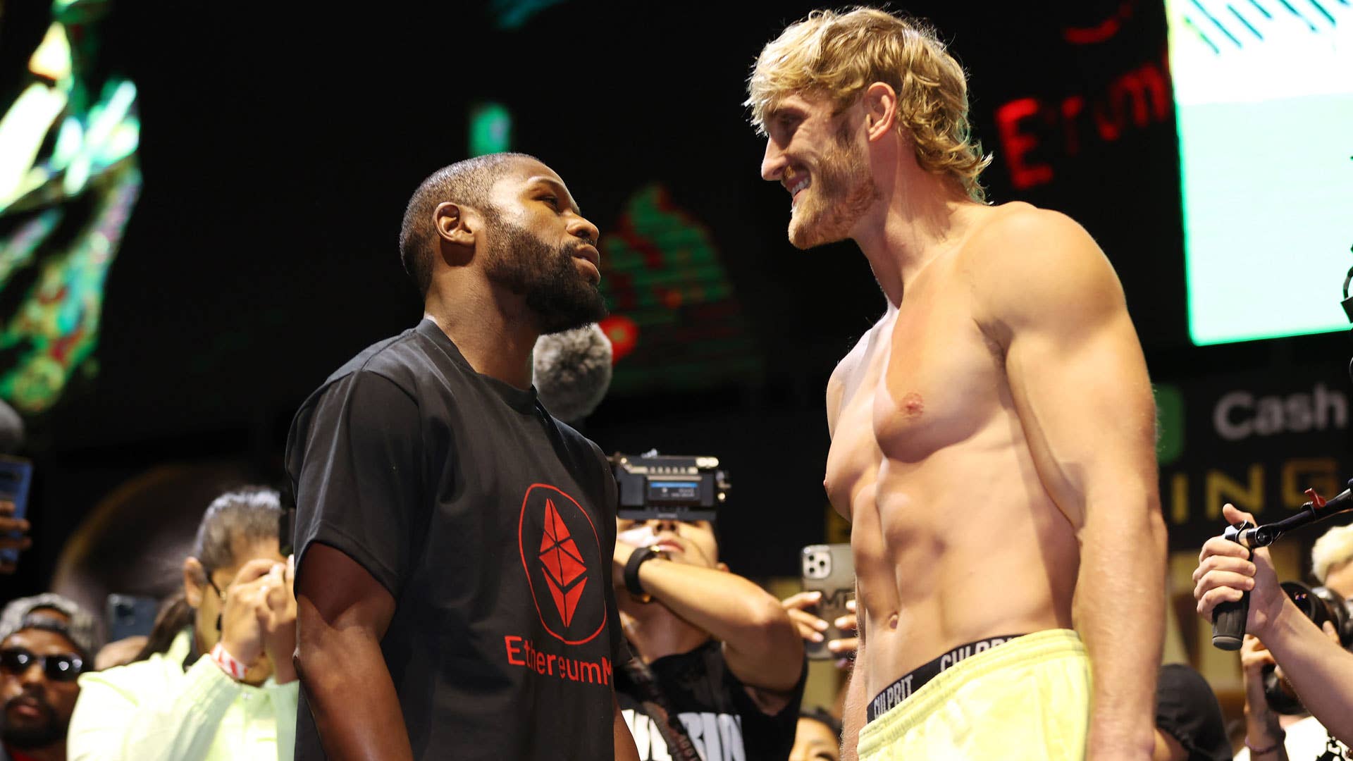 Floyd Mayweather and Logan Paul at their weigh-in