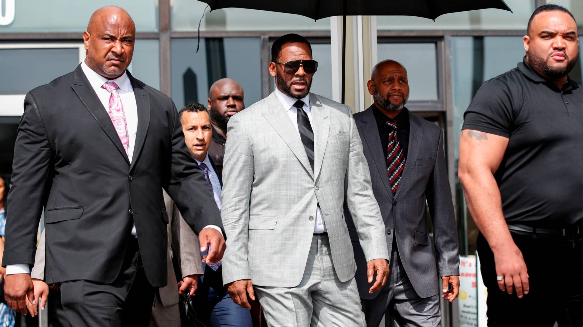 R Kelly is pictured outside a courthouse
