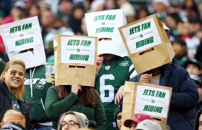 Jets fans with bags on their heads.