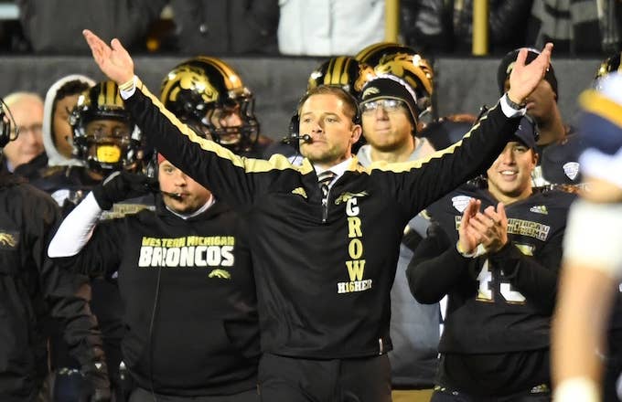 P.J. Fleck extends his arms, asking for the blessings of DJ Khaled.