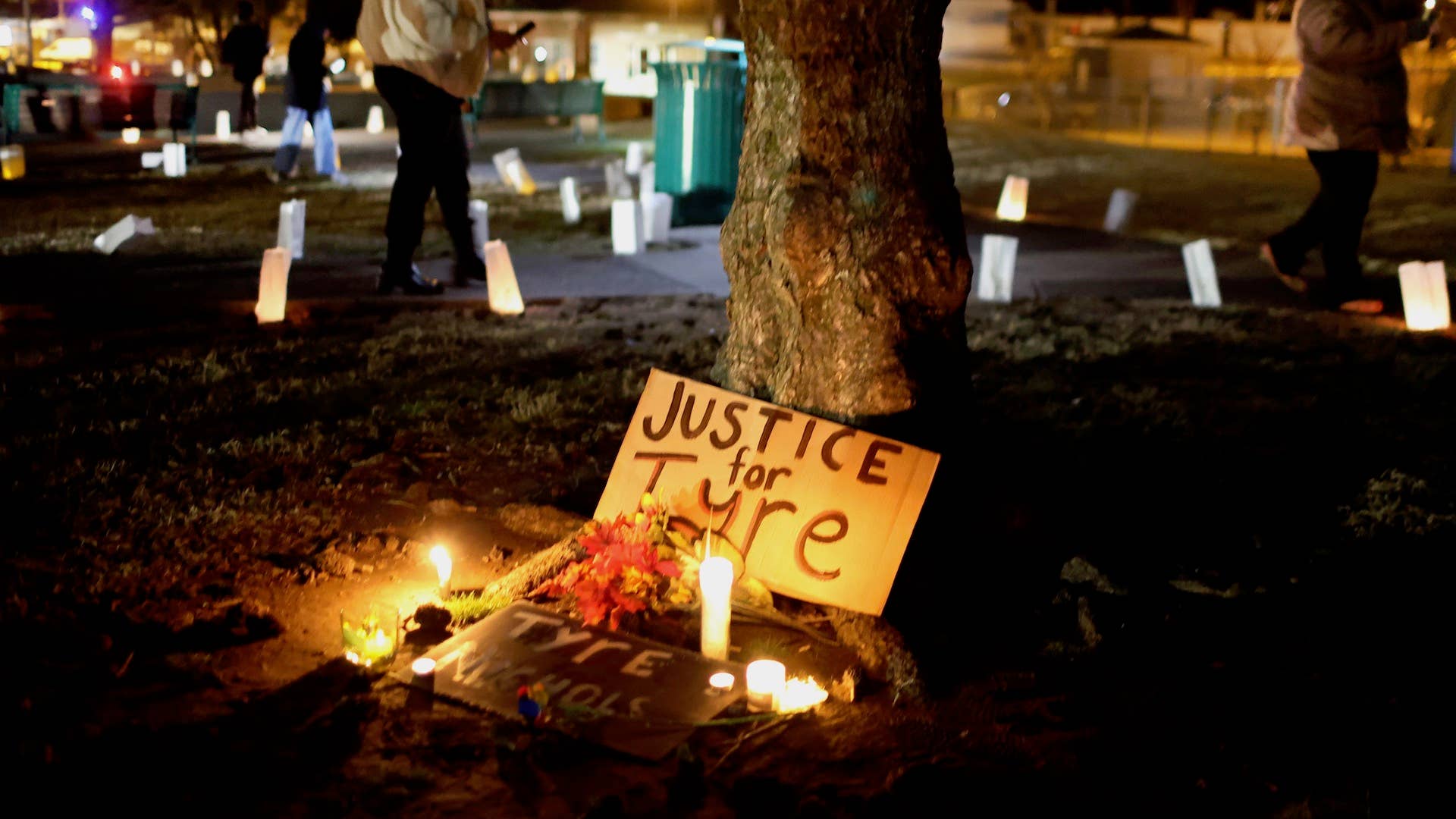 People attend a candlelight vigil in memory of Tyre Nichols