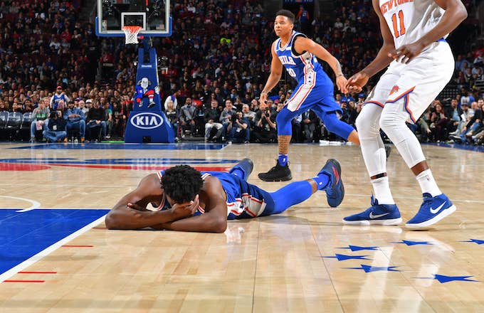 oel Embiid #21 of the Philadelphia 76ers lays on the court.
