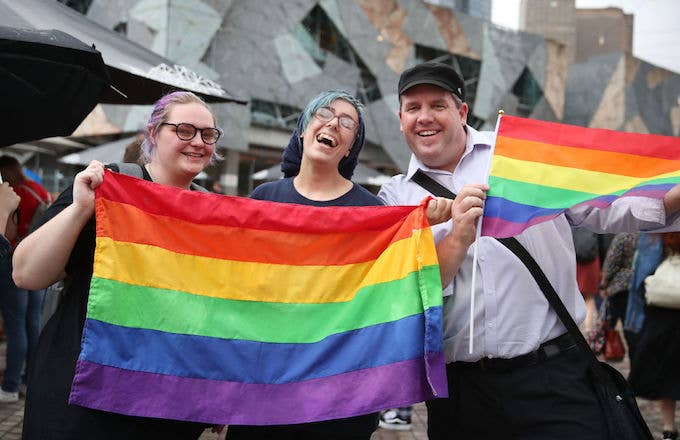 People celebrate Australia officially legalizing same sex marriage.