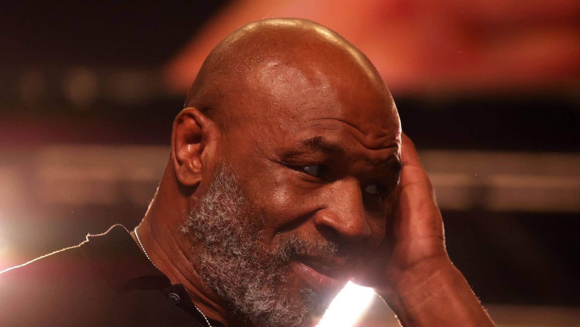 Mike Tyson looks on during the official weigh-in between Canelo Alvarez vs Caleb Plant