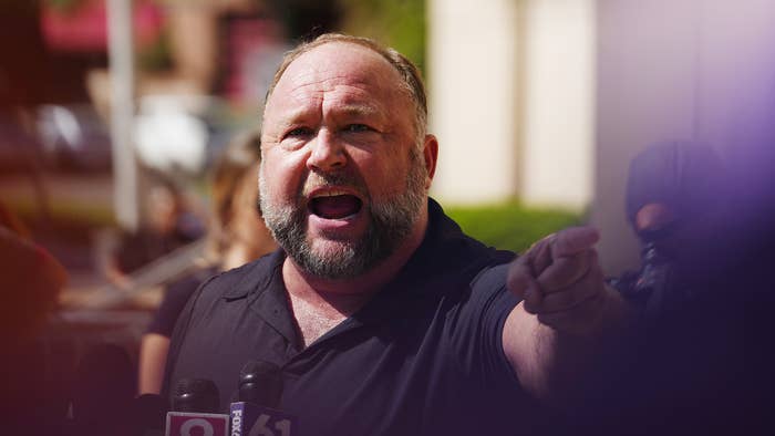 InfoWars founder Alex Jones speaks to the media outside Waterbury Superior Court