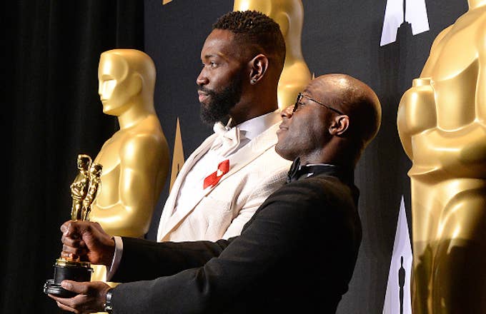 &#x27;Moonlight&#x27; director Barry Jenkins (R) and writer Tarell Alvin McCraney pose with the Oscar