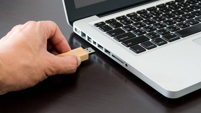 Photograph of a USB going into laptop