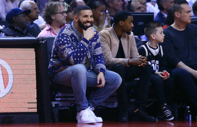 Drake sits courtside during 76ers/Raptors 2019 NBA Playoffs game. .