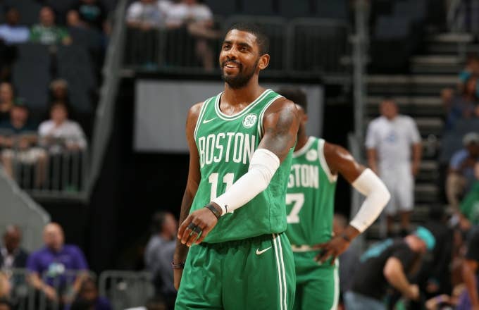 Kyrie Irving smiles on the court for the Celtics.
