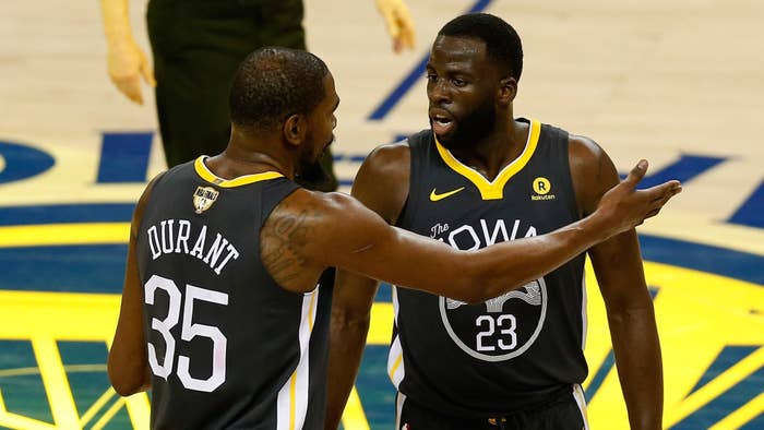 Kevin Durant talks with Draymond Green against the Cavaliers in the 2018 NBA Finals.