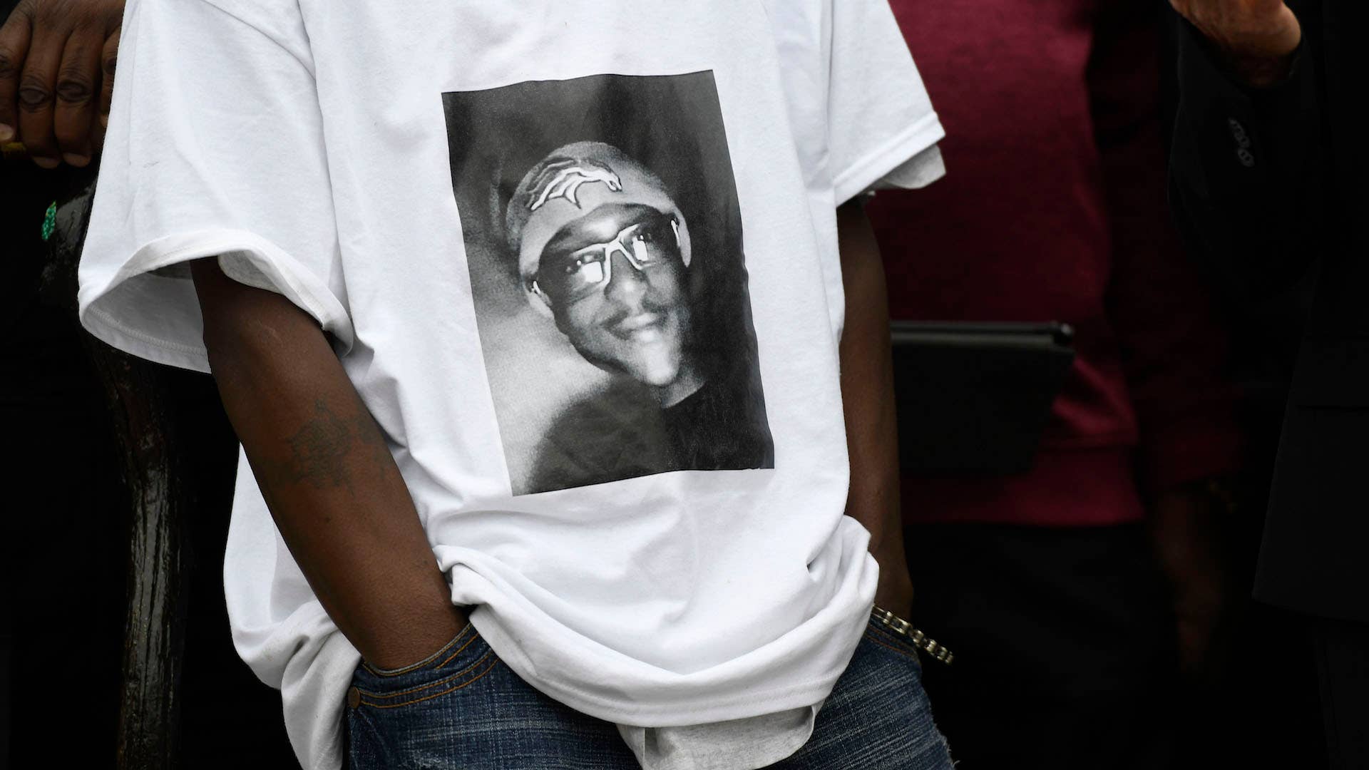 LaWayne Mosley, father of Elijah McClain, wears a t shirt with is son's picture on it.