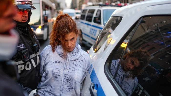 A woman is arrested by the NYPD during a ICE protest