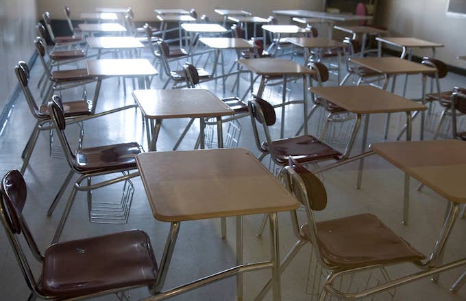 Empty chairs and desks in a high school classroom