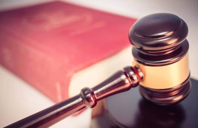 A gavel and closed law book.