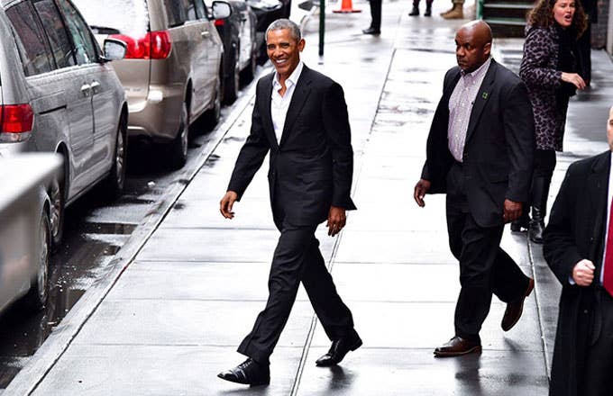 Barack Obama walking to his car in New York City.