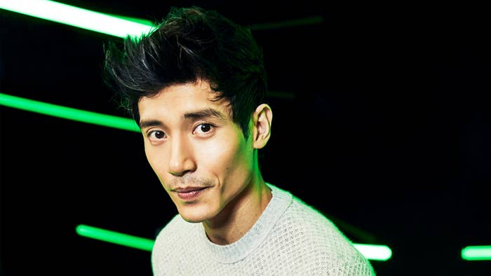 Manny Jacinto with green neon lights
