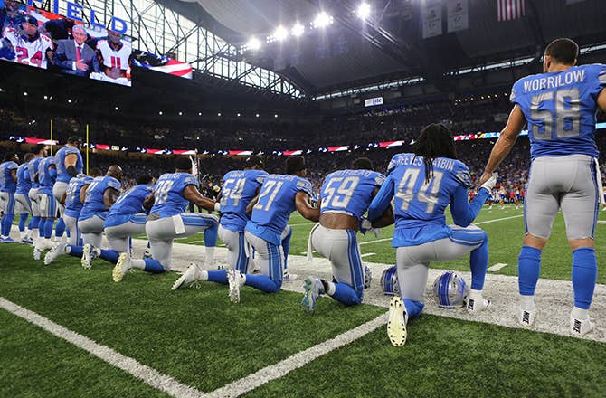 This is a photo of football players kneeling.
