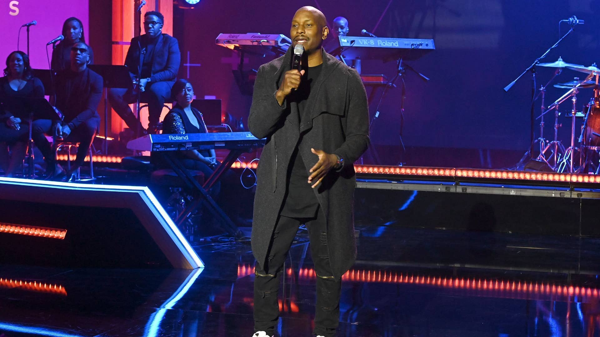 Tyrese Gibson is pictured with a microphone